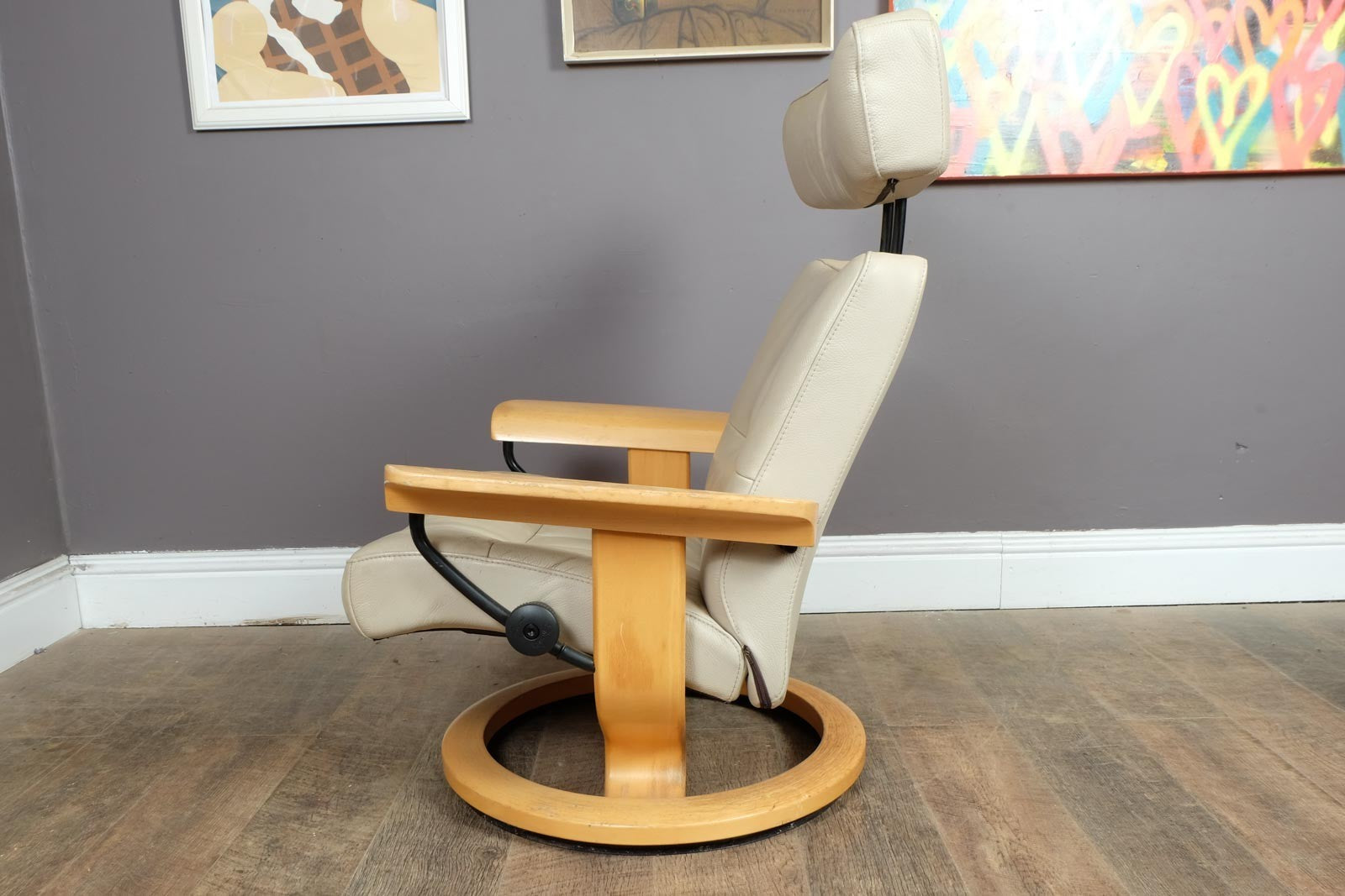 Vintage Stressless leather reclining armchair and footstool
