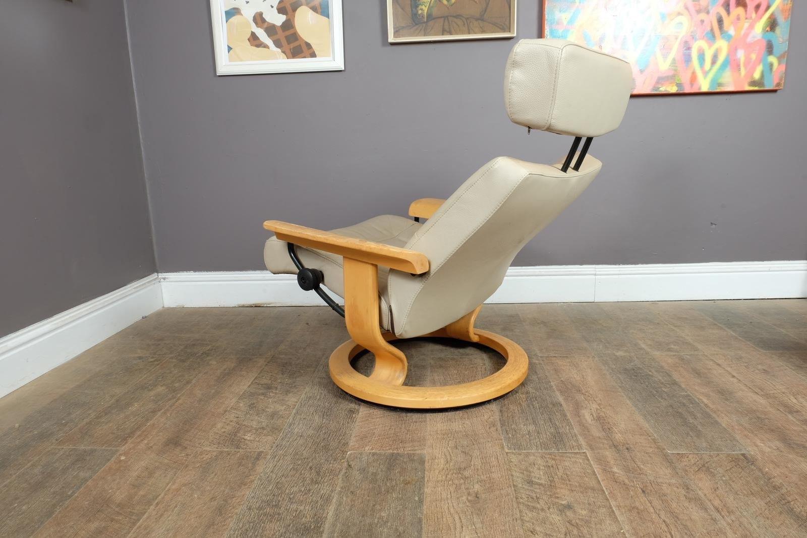 Vintage Stressless leather reclining armchair and footstool