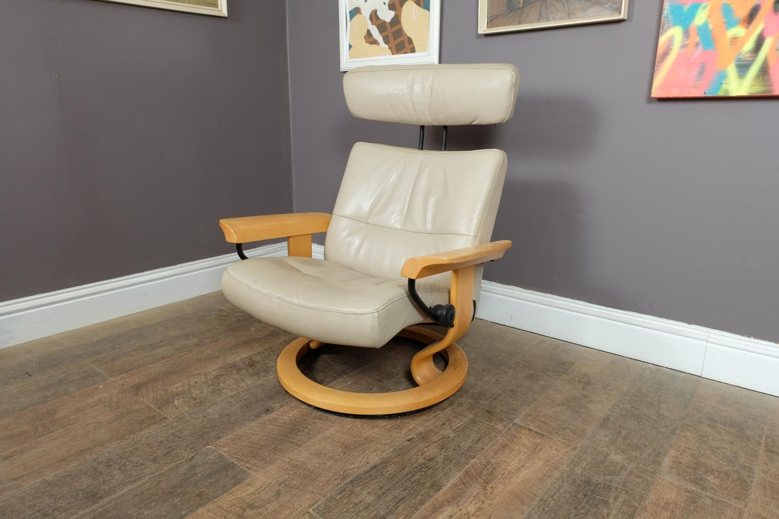 Vintage Stressless leather reclining armchair and footstool