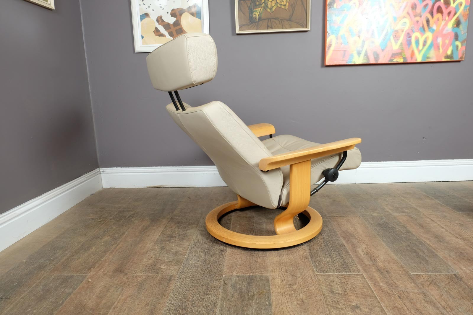 Vintage Stressless leather reclining armchair and footstool