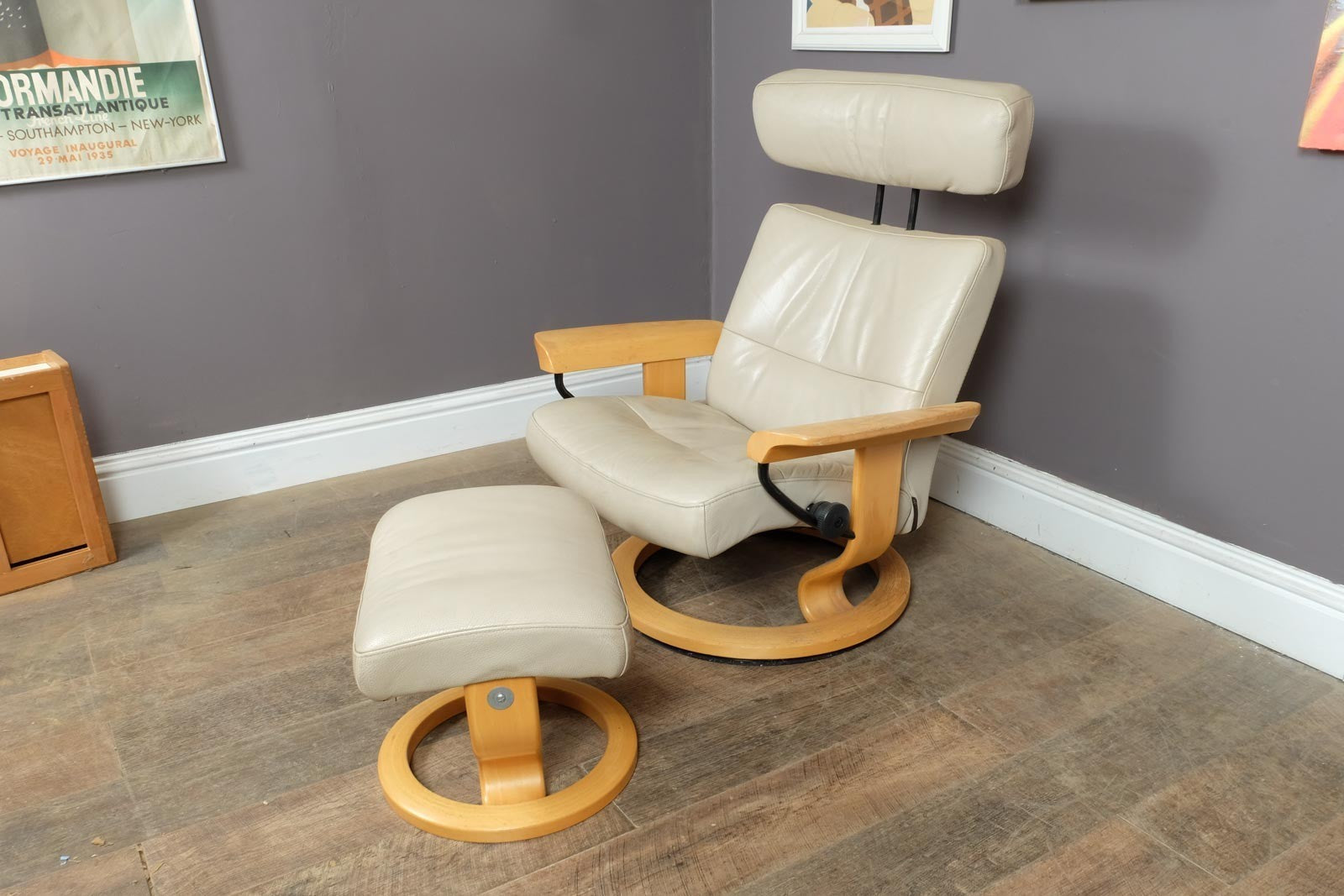Vintage Stressless leather reclining armchair and footstool