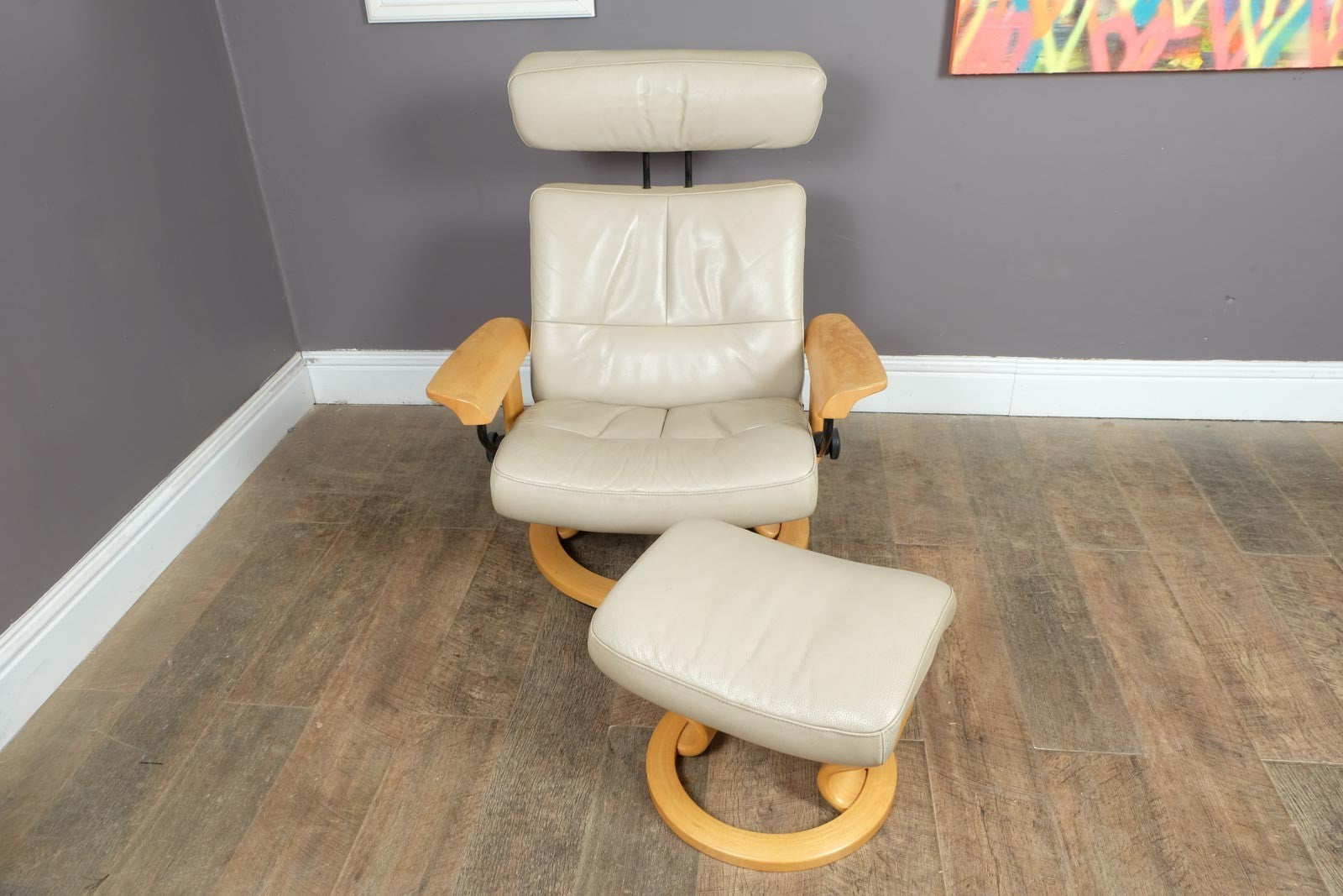 Vintage Stressless leather reclining armchair and footstool