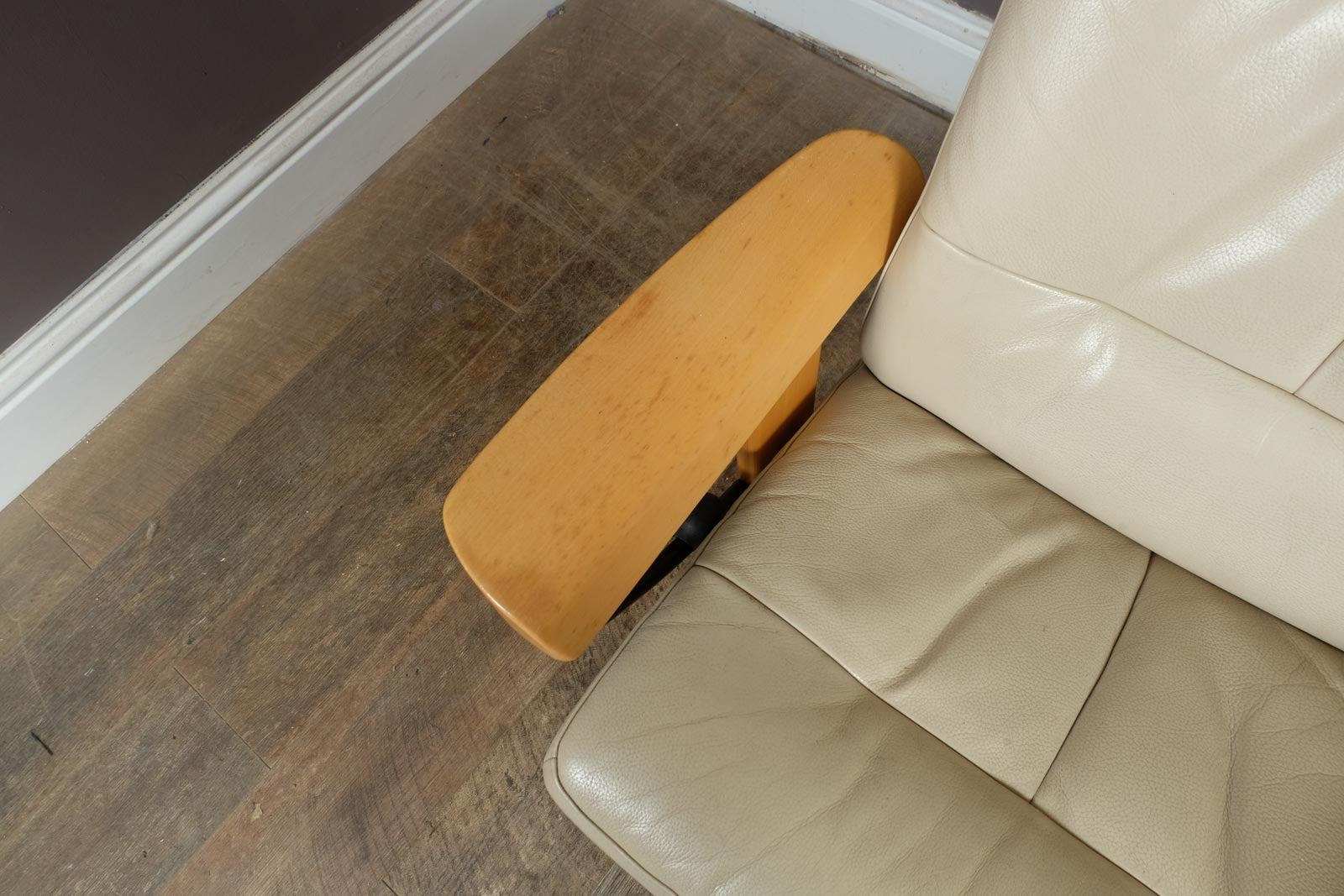 Vintage Stressless leather reclining armchair and footstool