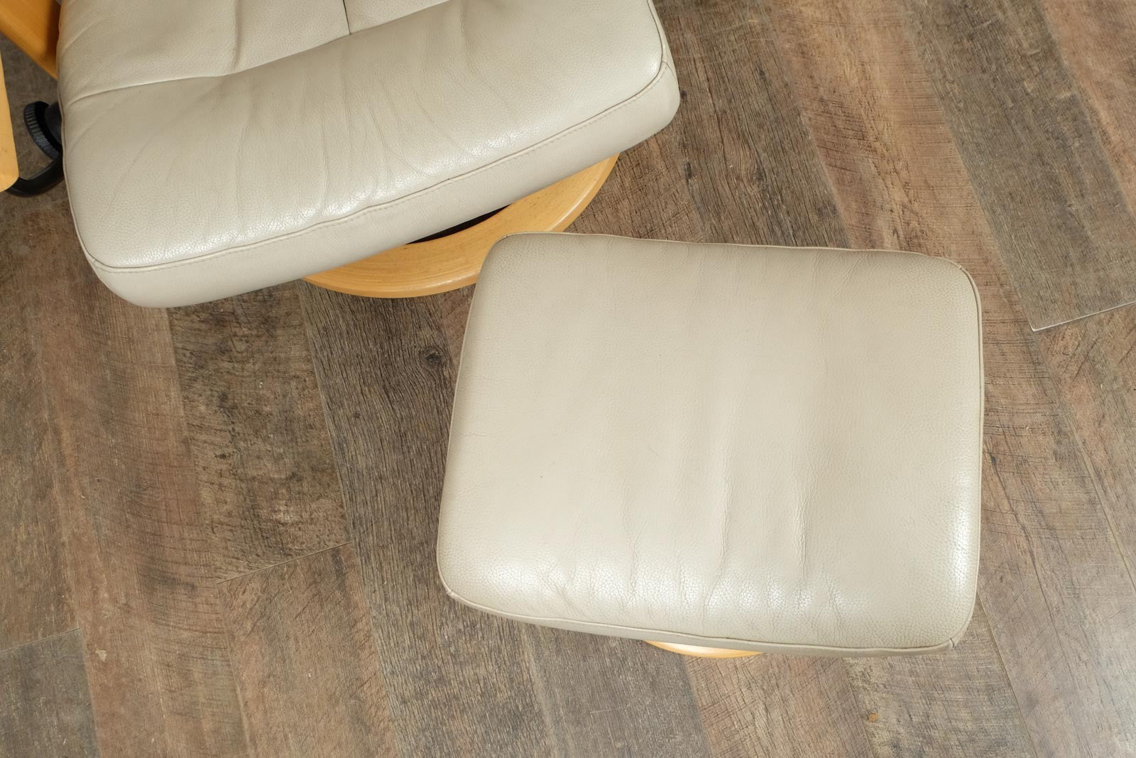 Vintage Stressless leather reclining armchair and footstool