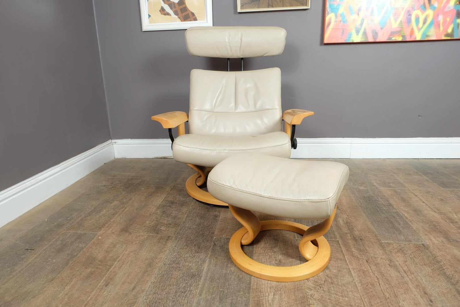 Vintage Stressless leather reclining armchair and footstool