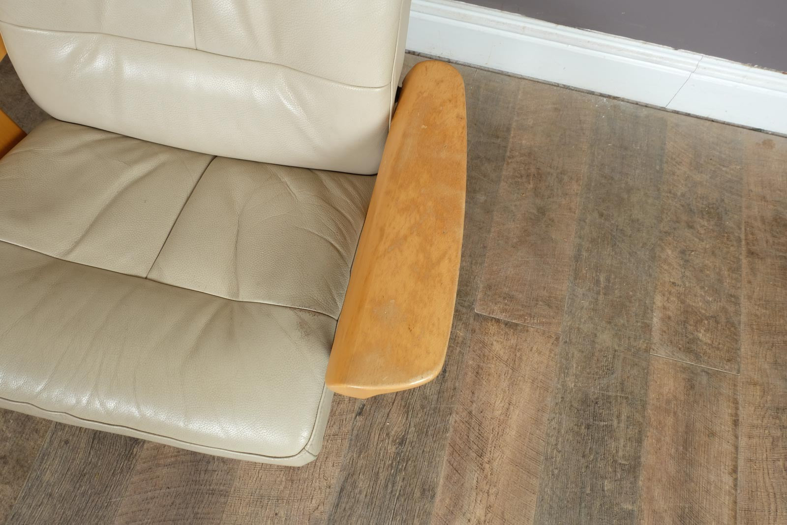 Vintage Stressless leather reclining armchair and footstool