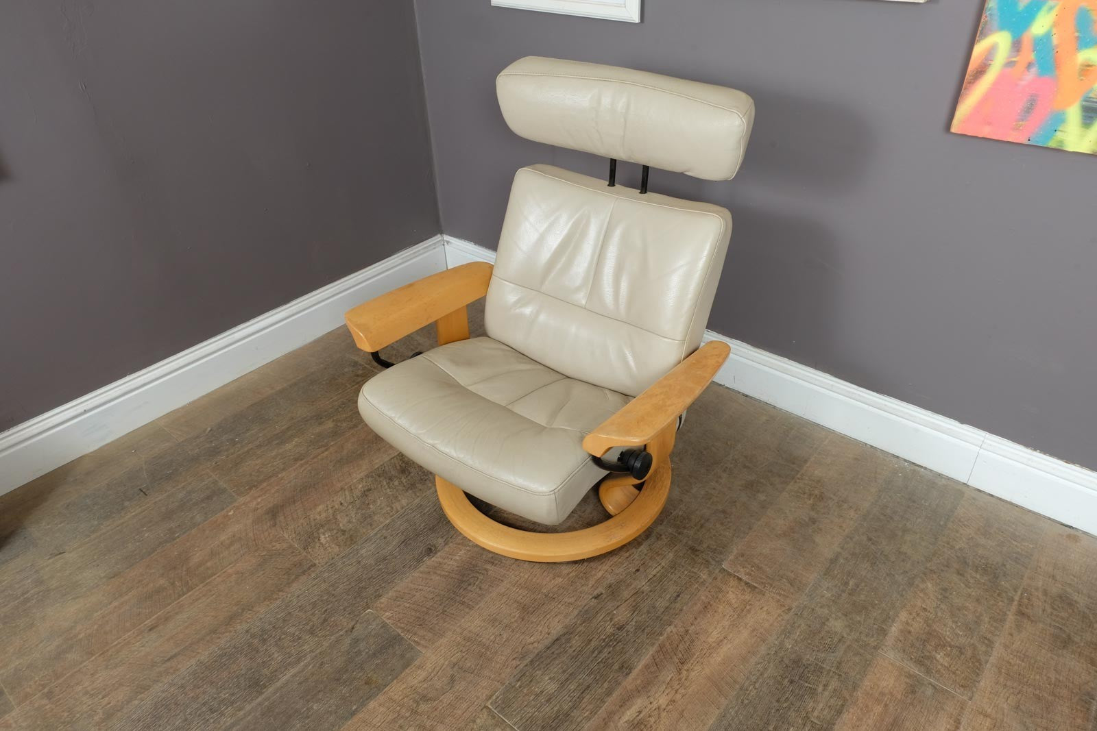 Vintage Stressless leather reclining armchair and footstool