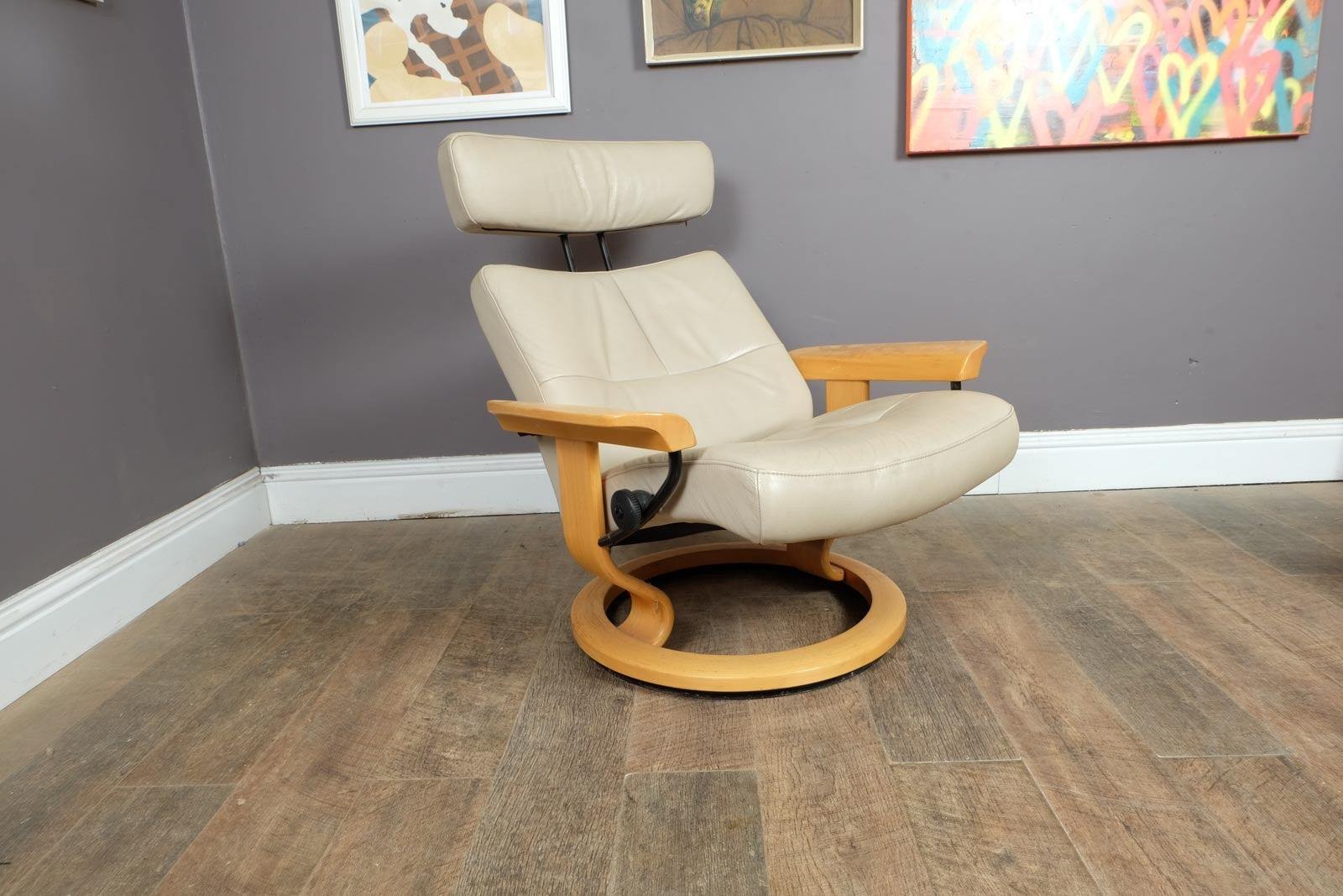 Vintage Stressless leather reclining armchair and footstool