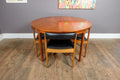 A H McIntosh Teak Extending Circular table and 4 Tuck Under Chairs