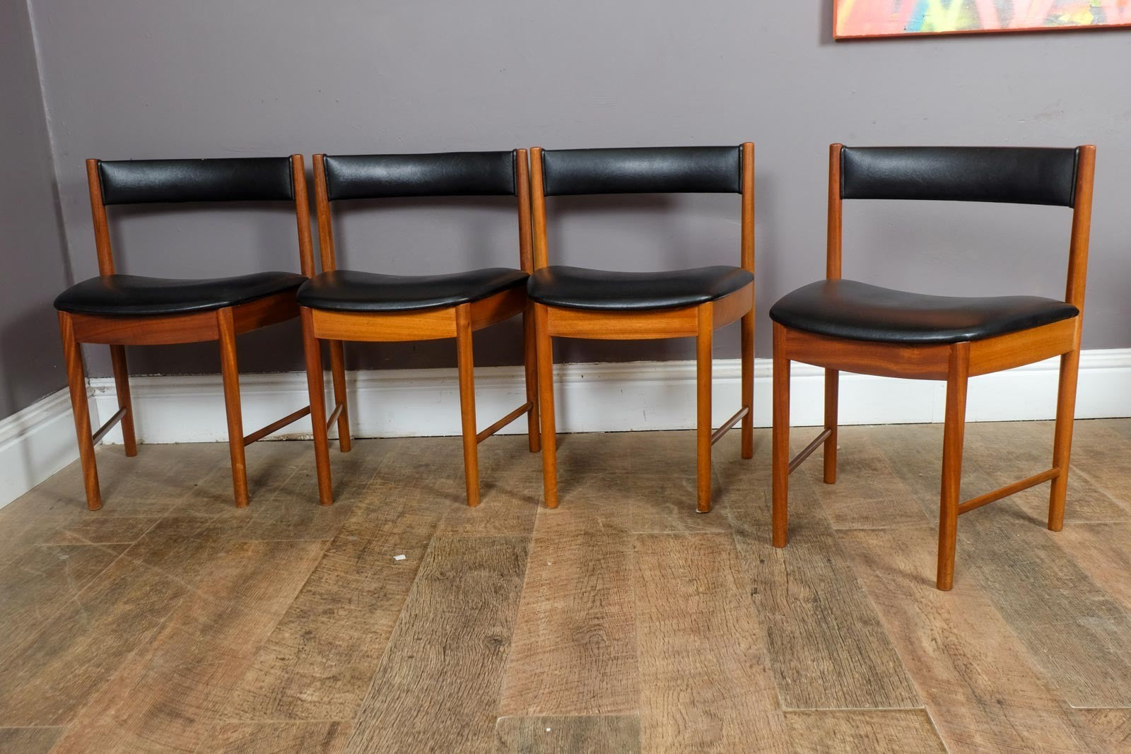 A H McIntosh Teak Extending Circular table and 4 Tuck Under Chairs
