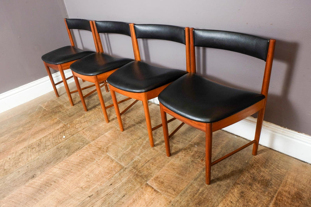 A H McIntosh Teak Extending Circular table and 4 Tuck Under Chairs