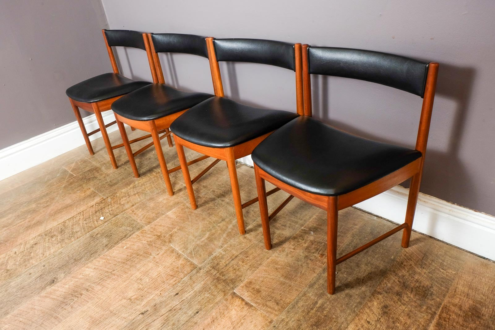 A H McIntosh Teak Extending Circular table and 4 Tuck Under Chairs