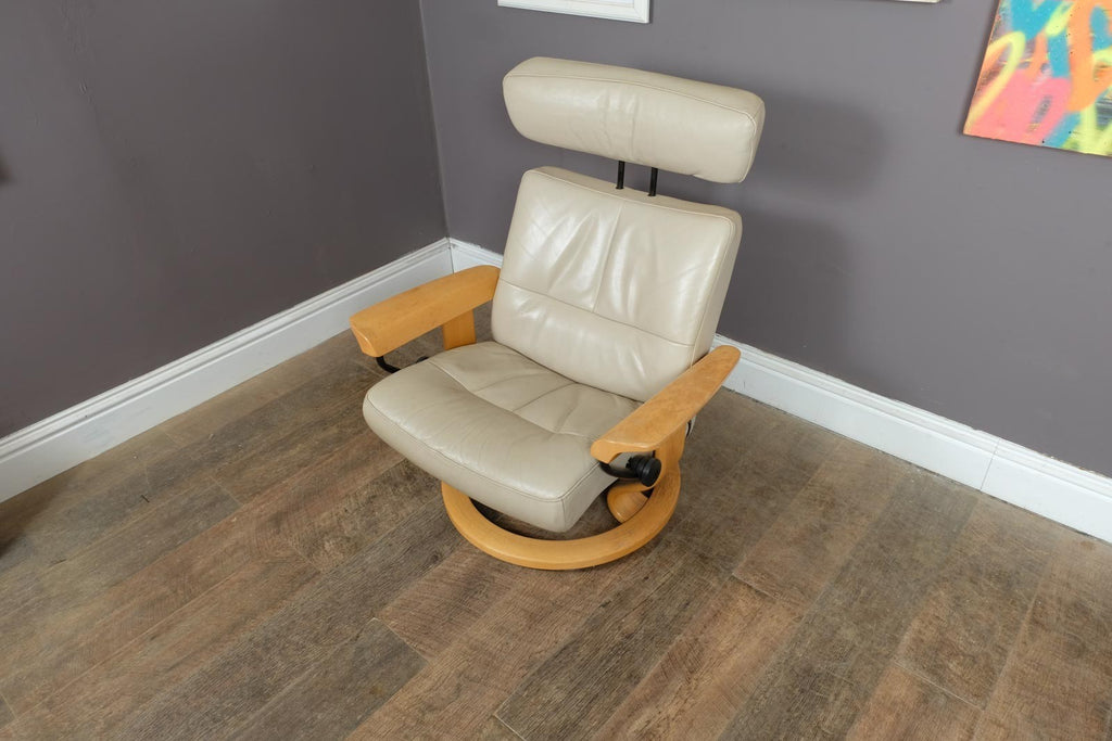 Vintage Stressless leather reclining armchair and footstool